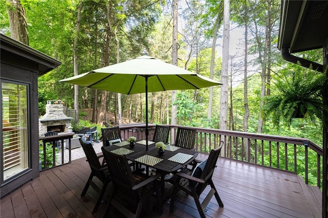 7974 Oak Brook Cir, Pittsford, NY 14534 - wooden terrace featuring an outdoor stone fireplace and outdoor dining space