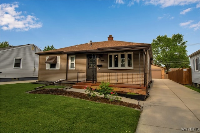 774 Loretta St, Tonawanda-Town, NY 14150 - view of front of home featuring a chimney, a garage, a front lawn, an outbuilding, and a shingled roof