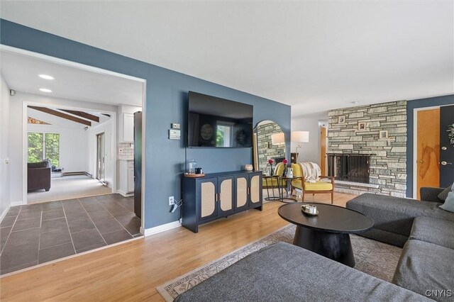 125 Huntshill Rd, Geddes, NY 13209 - living room featuring a fireplace and wood finished floors