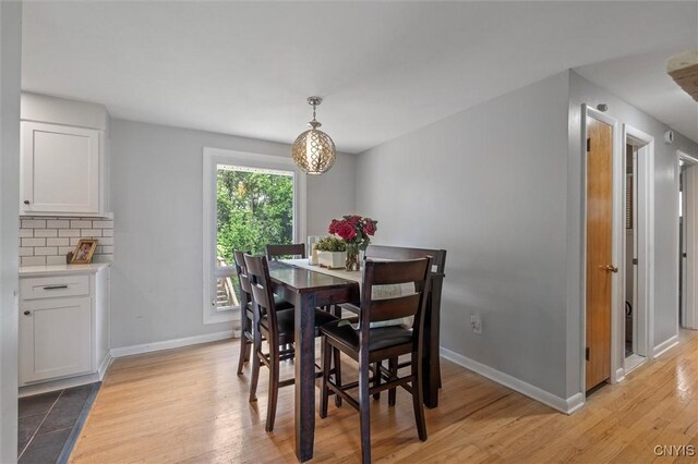 125 Huntshill Rd, Geddes, NY 13209 - dining space with light wood finished floors and baseboards