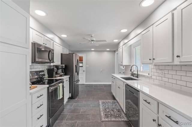125 Huntshill Rd, Geddes, NY 13209 - kitchen featuring appliances with stainless steel finishes, tasteful backsplash, white cabinetry, light countertops, and ceiling fan