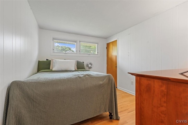 125 Huntshill Rd, Geddes, NY 13209 - bedroom featuring light wood-style floors and wood walls