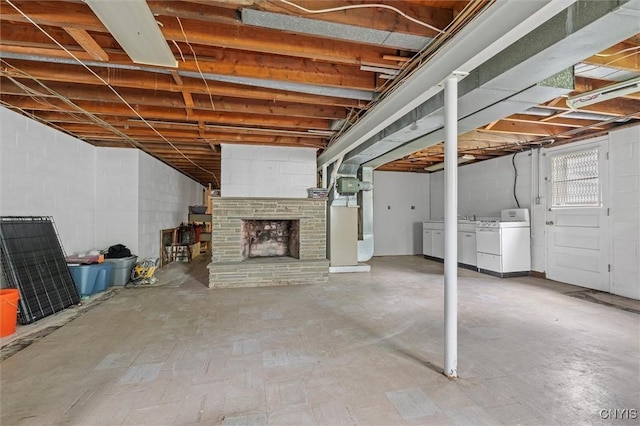 125 Huntshill Rd, Geddes, NY 13209 - below grade area with washer and clothes dryer, a fireplace, concrete block wall, and heating unit