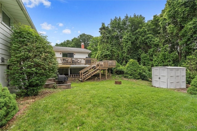 125 Huntshill Rd, Geddes, NY 13209 - view of green lawn featuring a wooden deck, stairs, and a storage shed