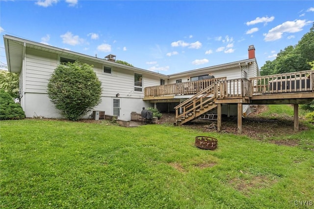 125 Huntshill Rd, Geddes, NY 13209 - back of property with a deck, a fire pit, stairs, and a yard
