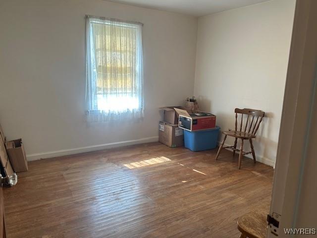 715 83rd St, Niagara Falls, NY 14304 - spare room featuring wood finished floors and baseboards