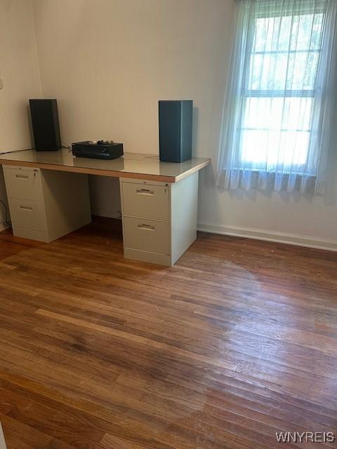 715 83rd St, Niagara Falls, NY 14304 - unfurnished office with dark wood-type flooring and built in desk