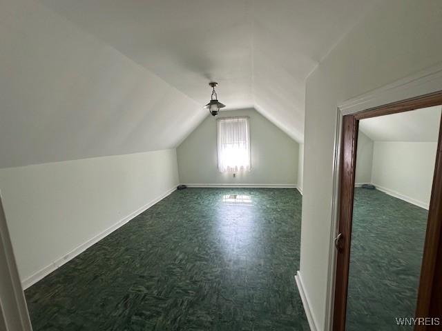 715 83rd St, Niagara Falls, NY 14304 - bonus room featuring lofted ceiling and baseboards