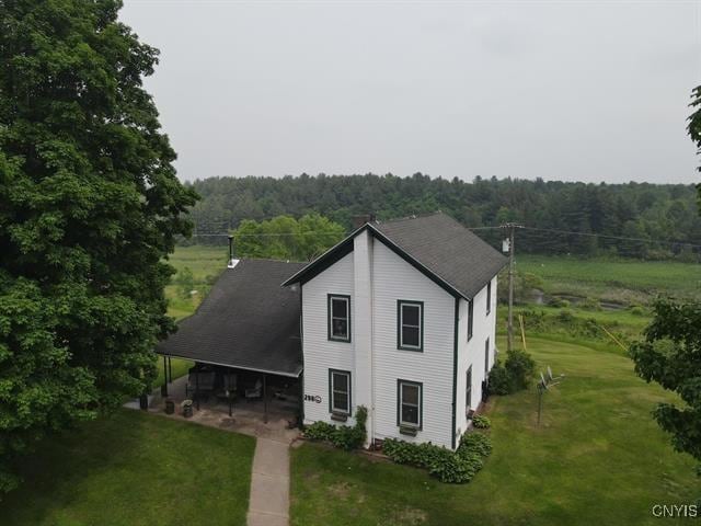 298 Maple Ridge Rd, Dekalb, NY 13681 - view of front of home with a wooded view and a front yard