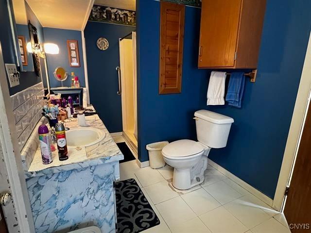298 Maple Ridge Rd, Dekalb, NY 13681 - bathroom with vanity, a stall shower, and tile patterned floors