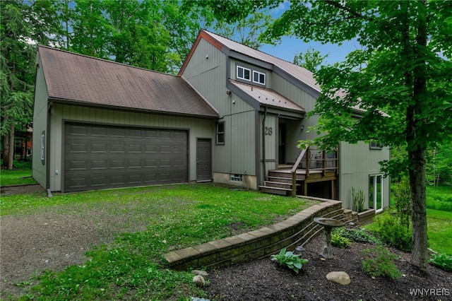 28 Woodstock Rd, Concord, NY 14069 - view of front of house with a garage, driveway, a metal roof, and a front yard