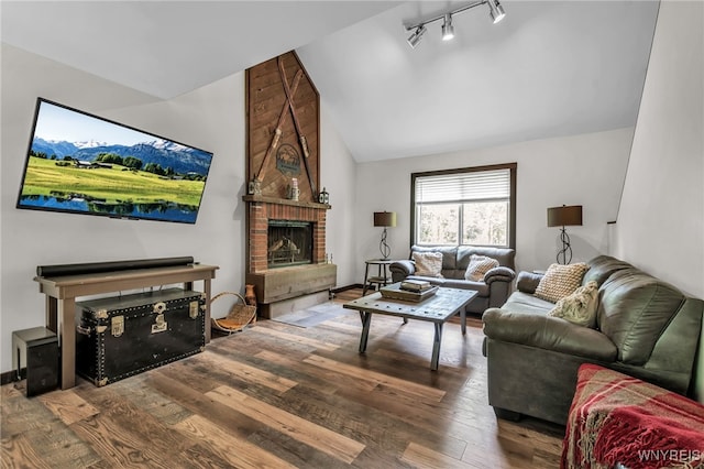 28 Woodstock Rd, Concord, NY 14069 - living area featuring hardwood / wood-style flooring, a fireplace, track lighting, and high vaulted ceiling
