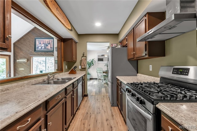 28 Woodstock Rd, Concord, NY 14069 - kitchen with appliances with stainless steel finishes, wall chimney range hood, light wood finished floors, light countertops, and a ceiling fan