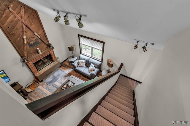 28 Woodstock Rd, Concord, NY 14069 - living area with track lighting, wood finished floors, and a fireplace