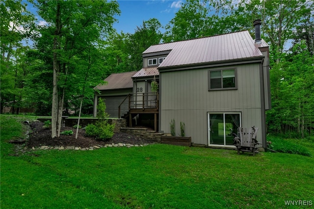 28 Woodstock Rd, Concord, NY 14069 - rear view of property with a yard, a metal roof, and stairway
