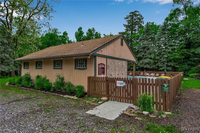 28 Woodstock Rd, Concord, NY 14069 - view of side of property with a shingled roof