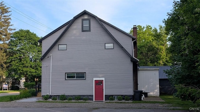 53 Utica St, Hamilton, NY 13346 - view of property exterior with a chimney