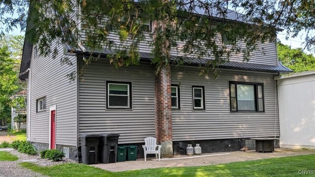 53 Utica St, Hamilton, NY 13346 - back of property with a patio