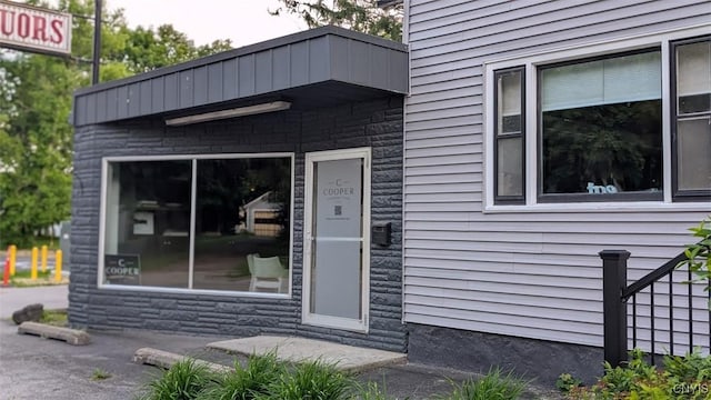 53 Utica St, Hamilton, NY 13346 - entrance to property featuring stone siding