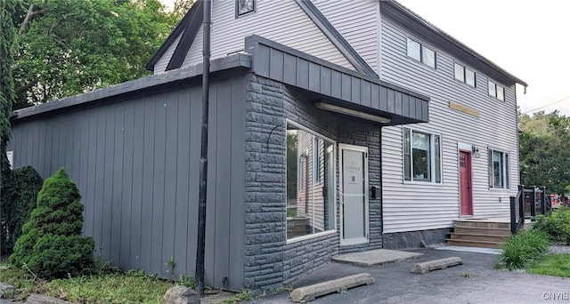 53 Utica St, Hamilton, NY 13346 - view of side of home featuring stone siding