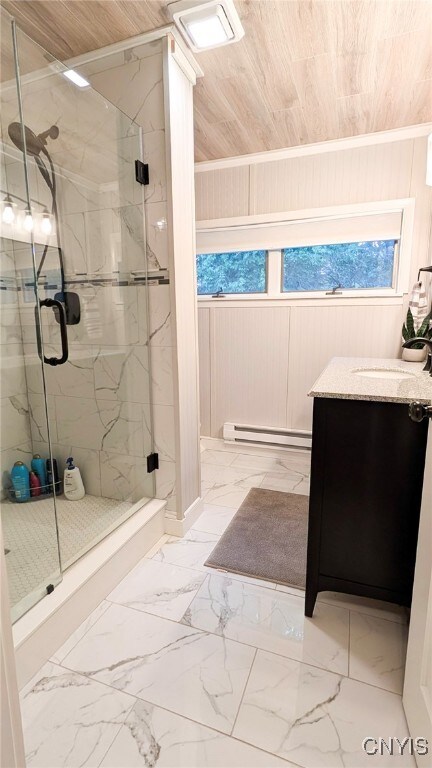 53 Utica St, Hamilton, NY 13346 - bathroom featuring marble finish floors, a baseboard radiator, a marble finish shower, and vanity