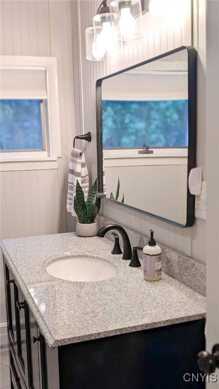 53 Utica St, Hamilton, NY 13346 - bathroom featuring vanity and a chandelier