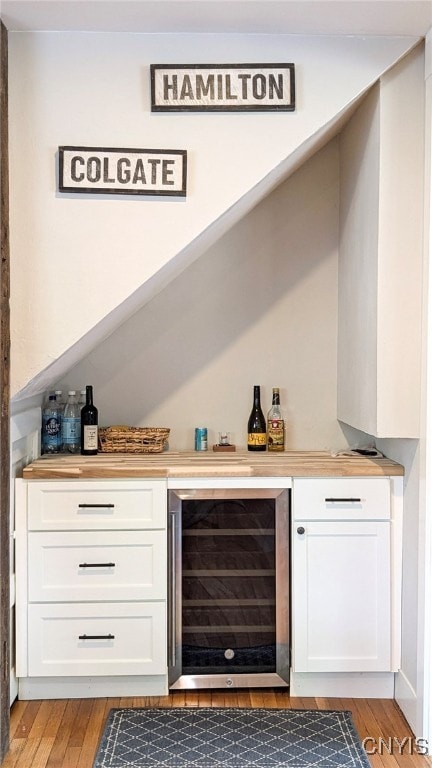 53 Utica St, Hamilton, NY 13346 - indoor dry bar with beverage cooler and light wood finished floors