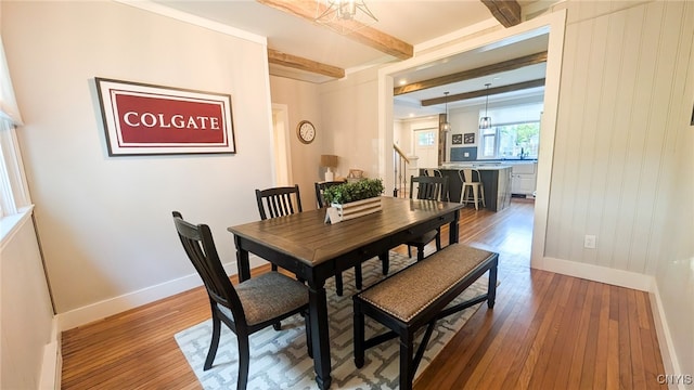 53 Utica St, Hamilton, NY 13346 - dining area featuring wood-type flooring and beam ceiling