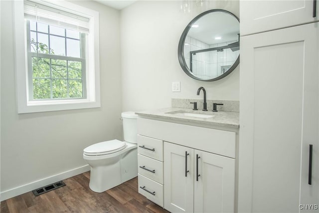 8367 S Main St, Le Ray, NY 13637 - full bathroom with vanity, wood finished floors, and a shower with door