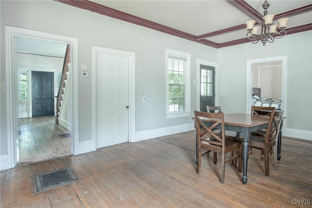 8367 S Main St, Le Ray, NY 13637 - dining space with a chandelier, stairway, hardwood / wood-style floors, and ornamental molding
