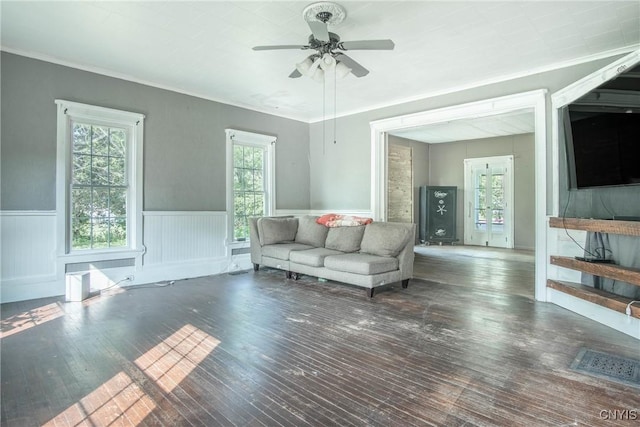 8367 S Main St, Le Ray, NY 13637 - living room with plenty of natural light, wainscoting, hardwood / wood-style floors, a ceiling fan, and ornamental molding