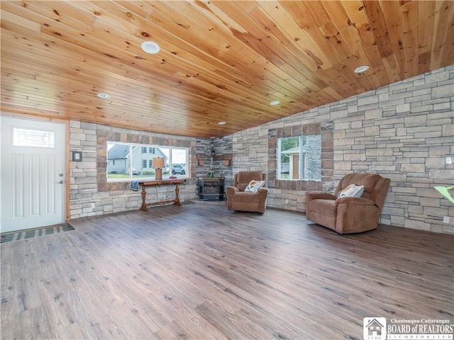 2389 Lakeside Dr, Busti, NY 14710 - living area featuring wood ceiling, a wood stove, wood finished floors, and vaulted ceiling