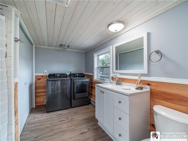 2389 Lakeside Dr, Busti, NY 14710 - washroom featuring separate washer and dryer, wainscoting, wood ceiling, light wood-style flooring, and crown molding