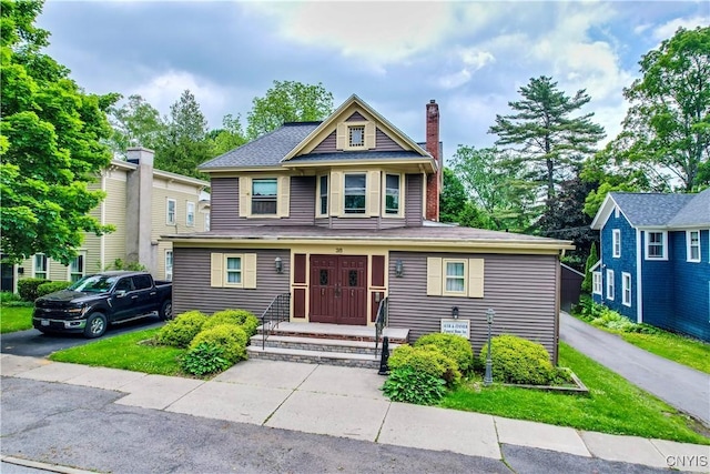 38 Sullivan St, Cazenovia, NY 13035 - view of front of property featuring a chimney and a shingled roof