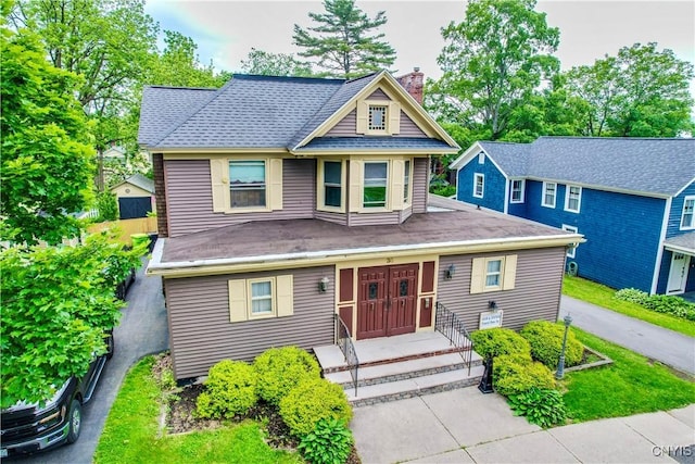 38 Sullivan St, Cazenovia, NY 13035 - view of front of property with a chimney and a shingled roof