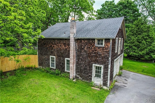 38 Sullivan St, Cazenovia, NY 13035 - view of outdoor structure with driveway and an attached garage