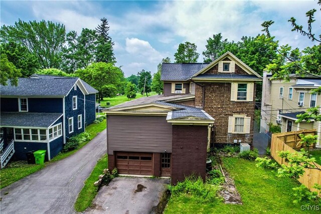 38 Sullivan St, Cazenovia, NY 13035 - view of front facade with driveway and a shingled roof