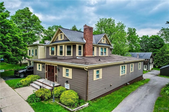 38 Sullivan St, Cazenovia, NY 13035 - view of front facade with a chimney and roof with shingles