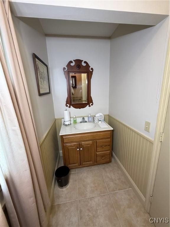 38 Sullivan St, Cazenovia, NY 13035 - bathroom with vanity, tile patterned floors, and wainscoting