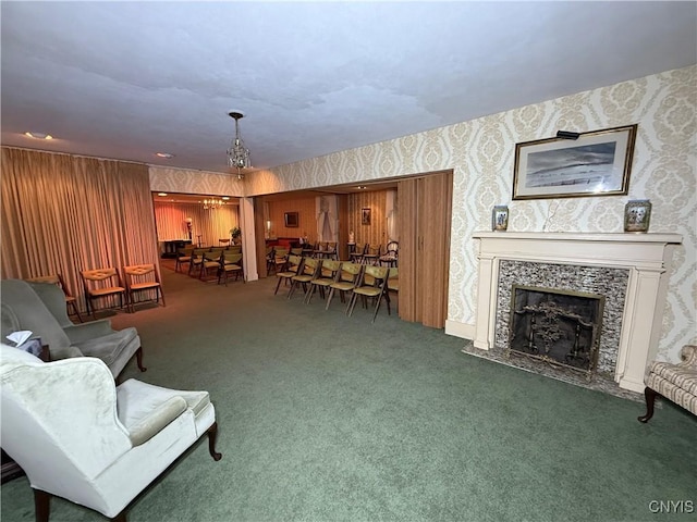 38 Sullivan St, Cazenovia, NY 13035 - living area featuring carpet floors, wallpapered walls, a chandelier, and a tile fireplace