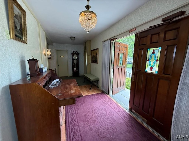 38 Sullivan St, Cazenovia, NY 13035 - entrance foyer featuring a chandelier, wood finished floors, and a textured wall