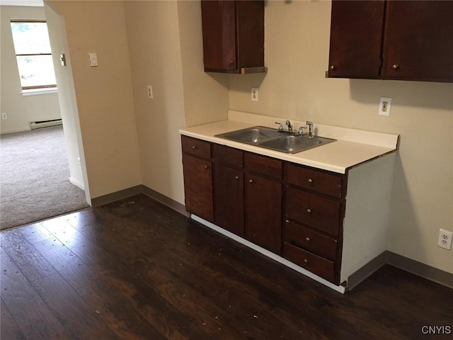 20 Park Ave, Sandy Creek, NY 13083 - kitchen featuring a baseboard radiator, dark brown cabinetry, and dark wood-type flooring