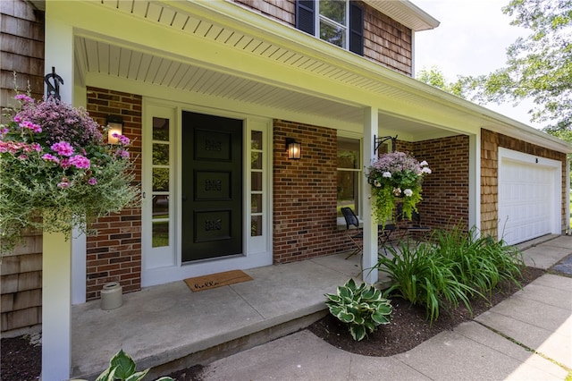 16 Aquarius Ln, Greece, NY 14612 - doorway to property with a porch, brick siding, and a garage