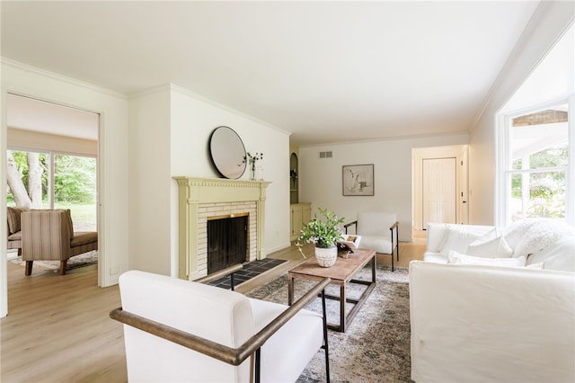 16 Aquarius Ln, Greece, NY 14612 - living room with ornamental molding, light wood-style flooring, and a brick fireplace