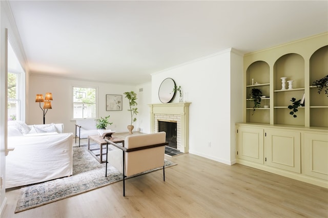 16 Aquarius Ln, Greece, NY 14612 - living room with light wood-style floors, a brick fireplace, and ornamental molding