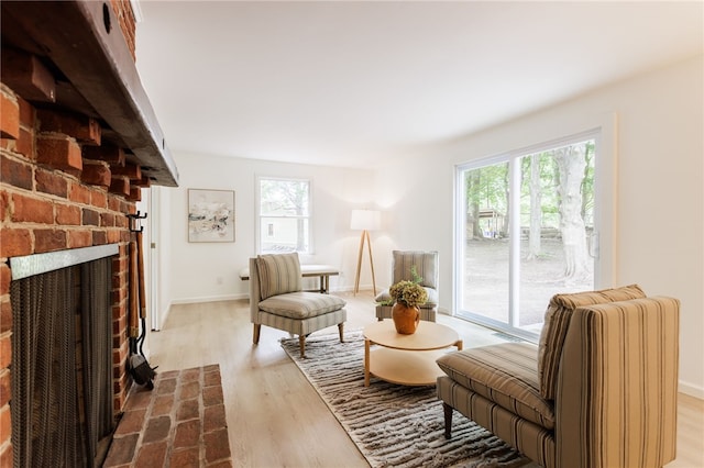 16 Aquarius Ln, Greece, NY 14612 - sitting room featuring wood finished floors and a brick fireplace
