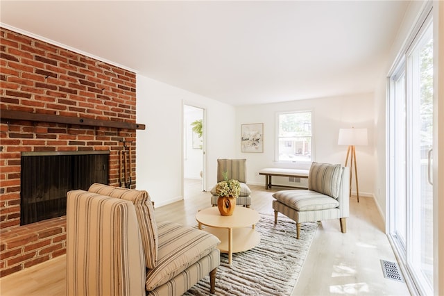 16 Aquarius Ln, Greece, NY 14612 - living room with plenty of natural light, light wood-type flooring, and a fireplace