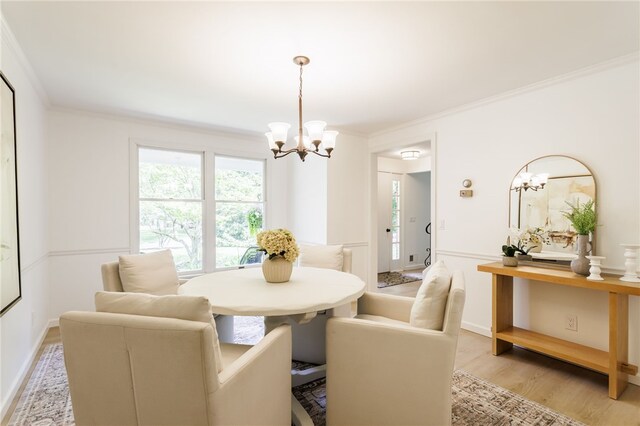16 Aquarius Ln, Greece, NY 14612 - dining space with a chandelier, light wood-style flooring, and crown molding