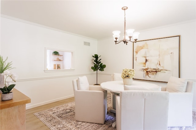 16 Aquarius Ln, Greece, NY 14612 - dining space with ornamental molding, a chandelier, and wood finished floors