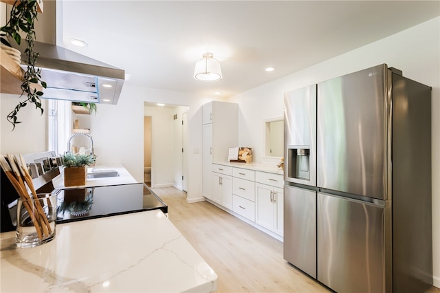 16 Aquarius Ln, Greece, NY 14612 - kitchen featuring stainless steel refrigerator with ice dispenser, range hood, light wood-style flooring, white cabinets, and light stone counters